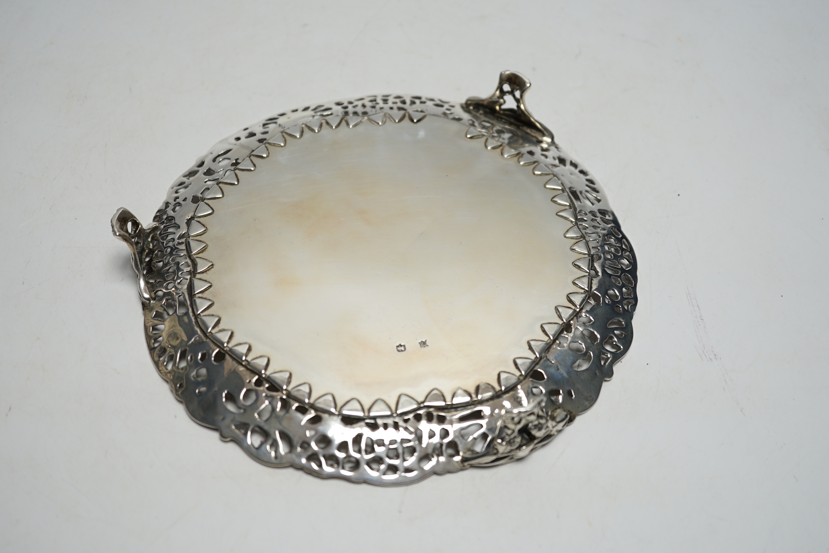 A silver card tray with pierced border, Edward Hutton, maker's mark and lion only, 20.3cm, 12.4oz.